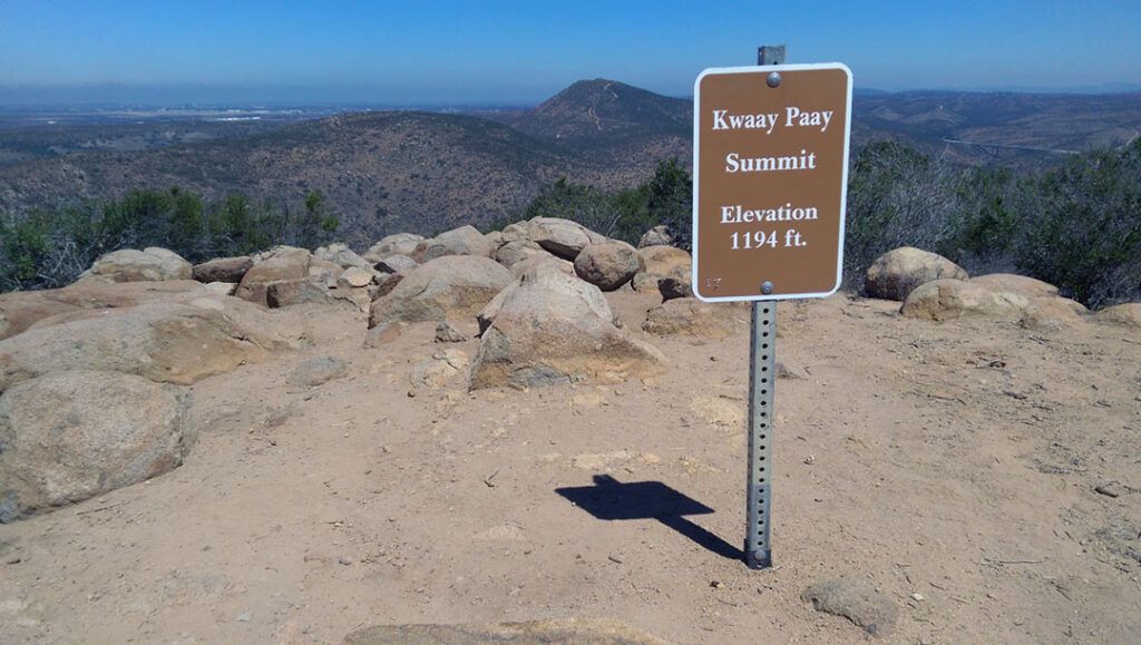 A summit sign on the summit of Kwaay Paay Peak