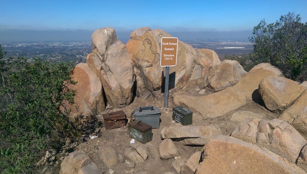 North Fortuna Summit trail sign and hiker boxes