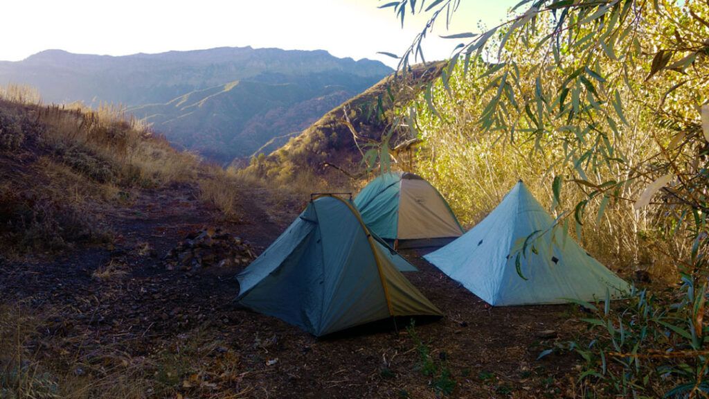 Three tents overlook the valley from Willet Springs Campsite in Los Padres National Forest.