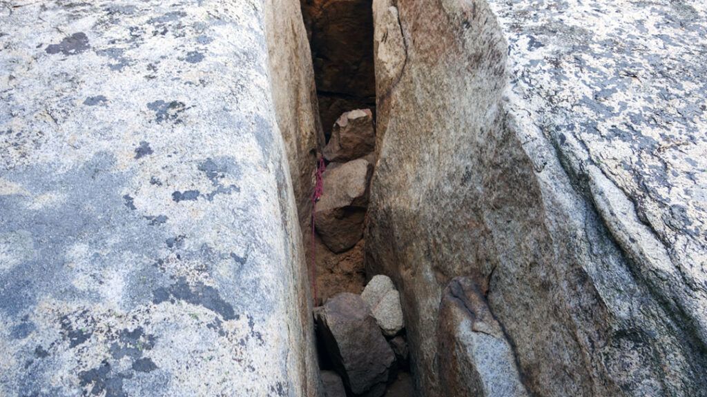 A crack in the face of Lawson Peak leads to a cave just below the summit.