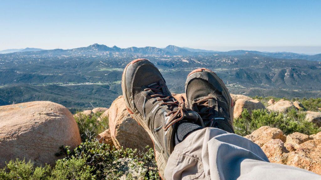 Looking over hiking shoes towards Lawson and Gaskill Peaks from Bell Bluff’s summit.