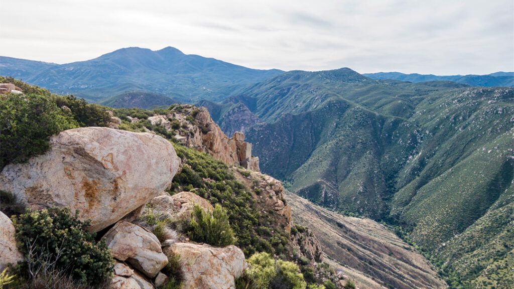 View east from Eagle Peak with rock outcropping in foreground
